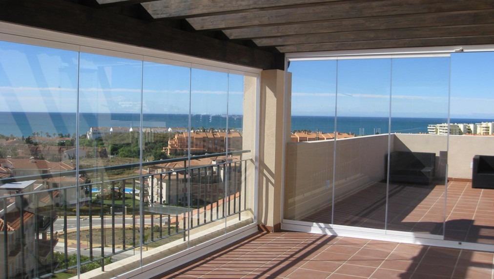 Cortinas cristal abatibles terraza Sevilla